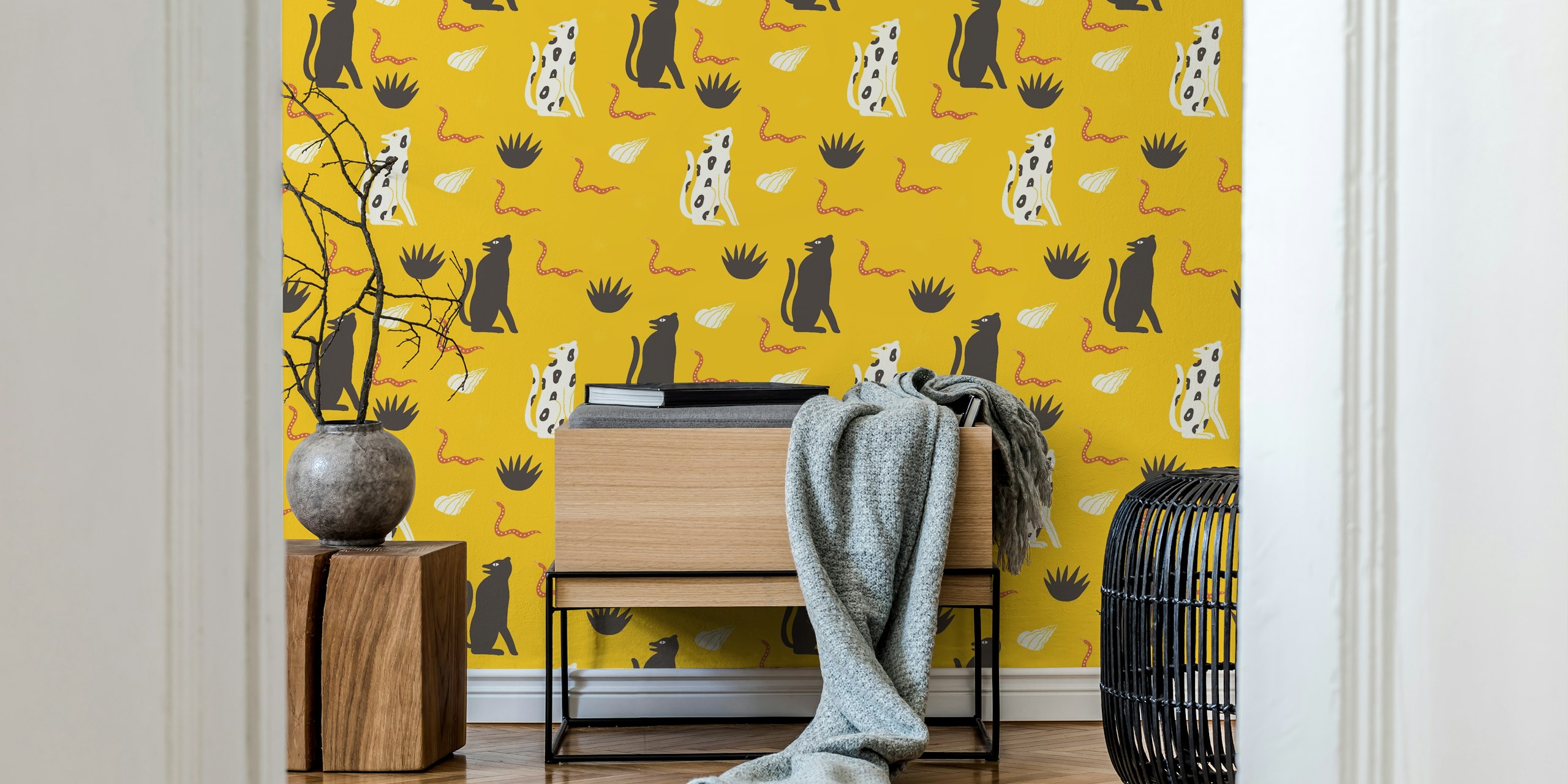 Yellow wallpaper with black and white cheetahs, plants, shells, and snakes in a playful design