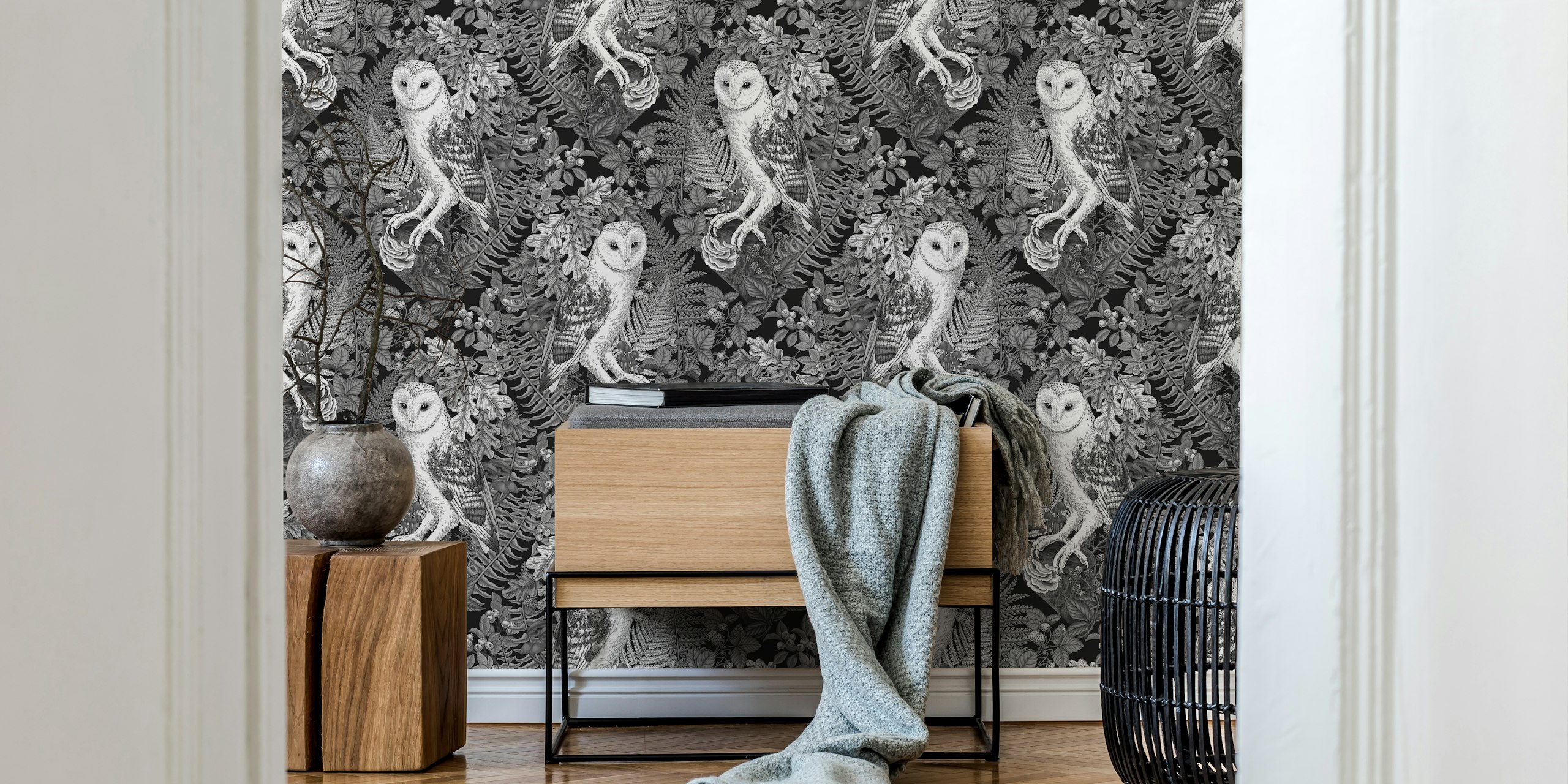 Monochrome owls and ferns wallpaper in a room