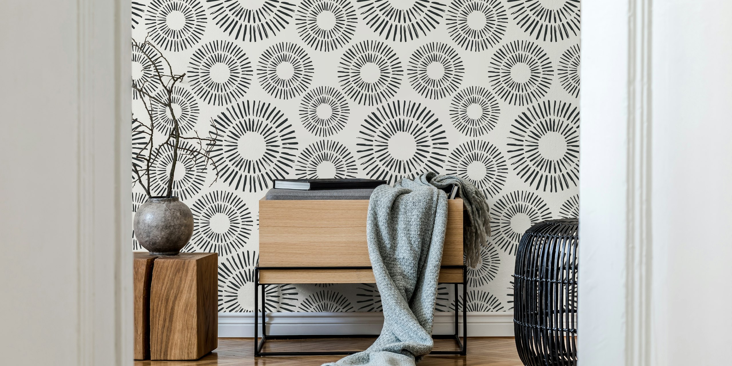 Black and white sun pattern wallpaper with circular designs and rays