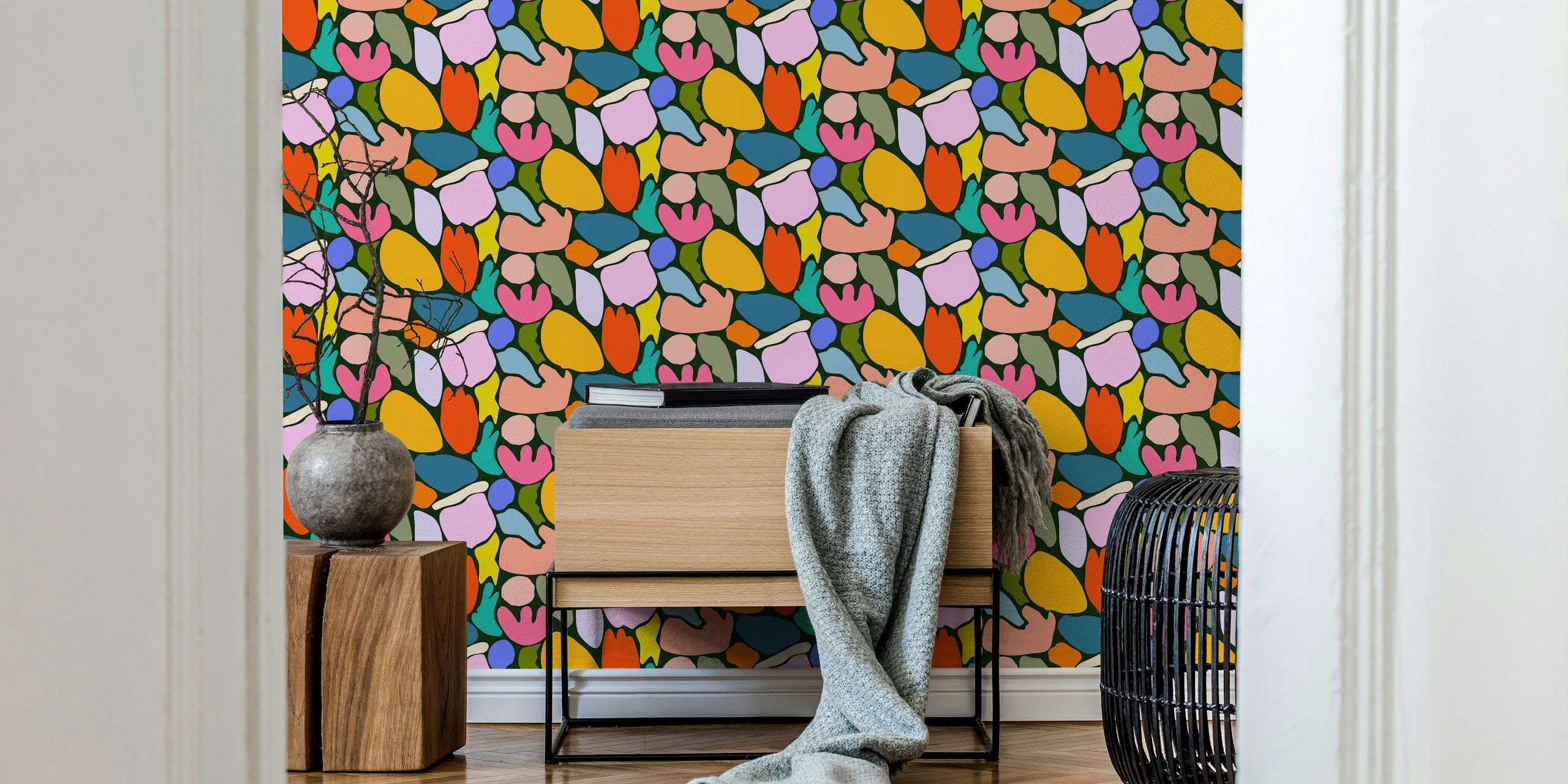 Abstract floral wall mural on a black background with colorful shapes
