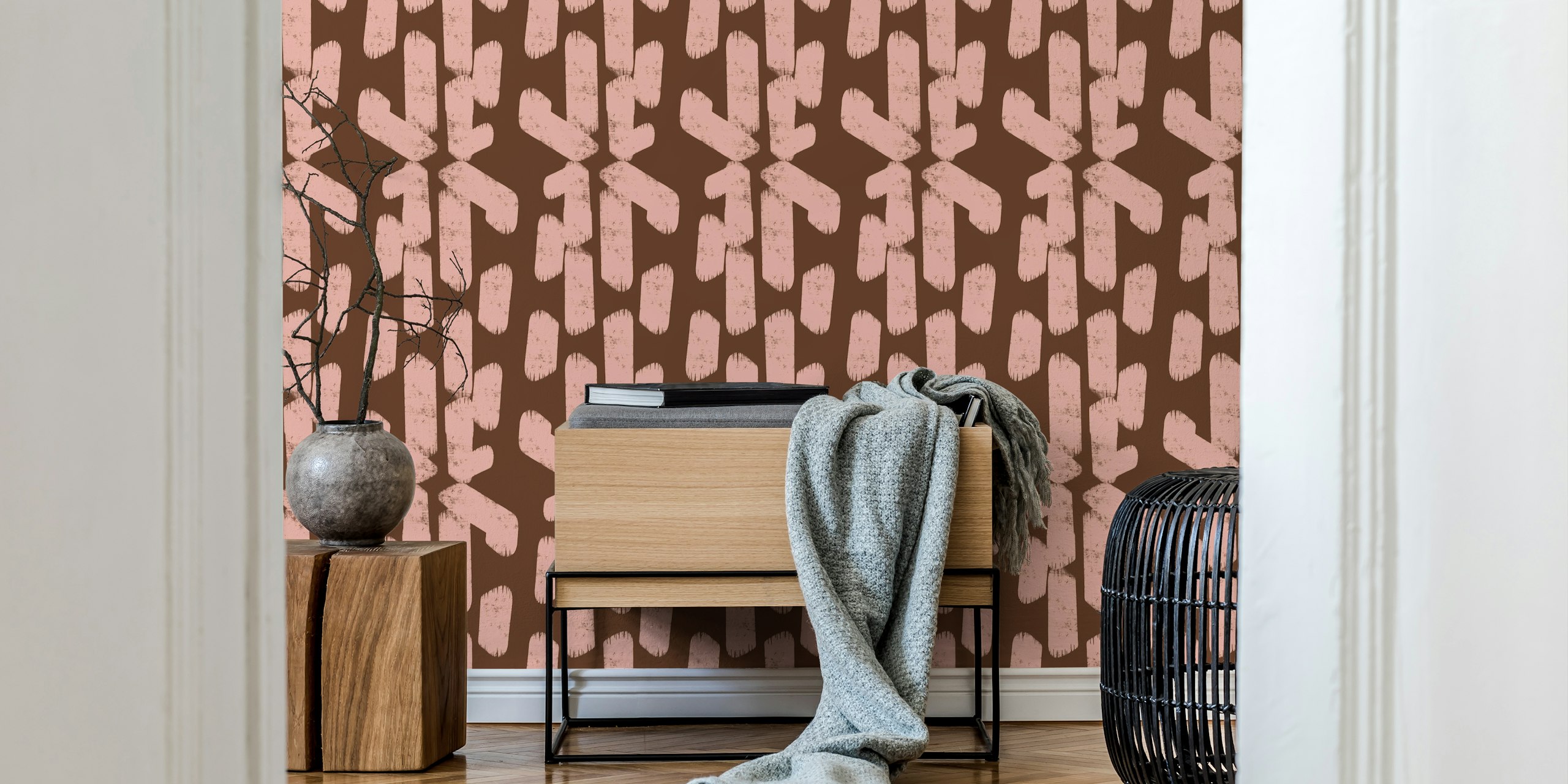 Geometric shapes in pink and brown on textured wallpaper