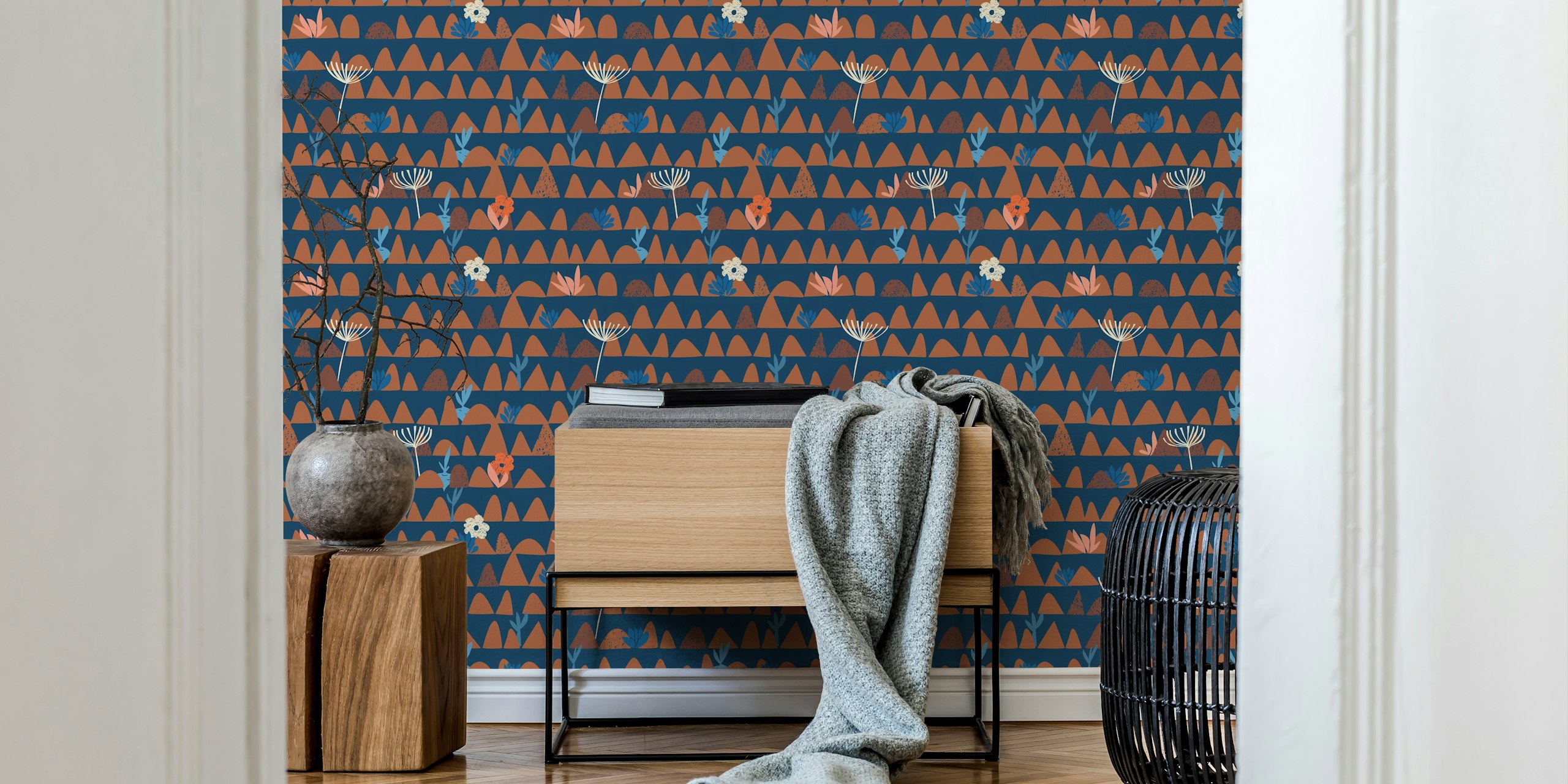 Dark blue wallpaper featuring floral motifs and mountain shapes in earthy tones