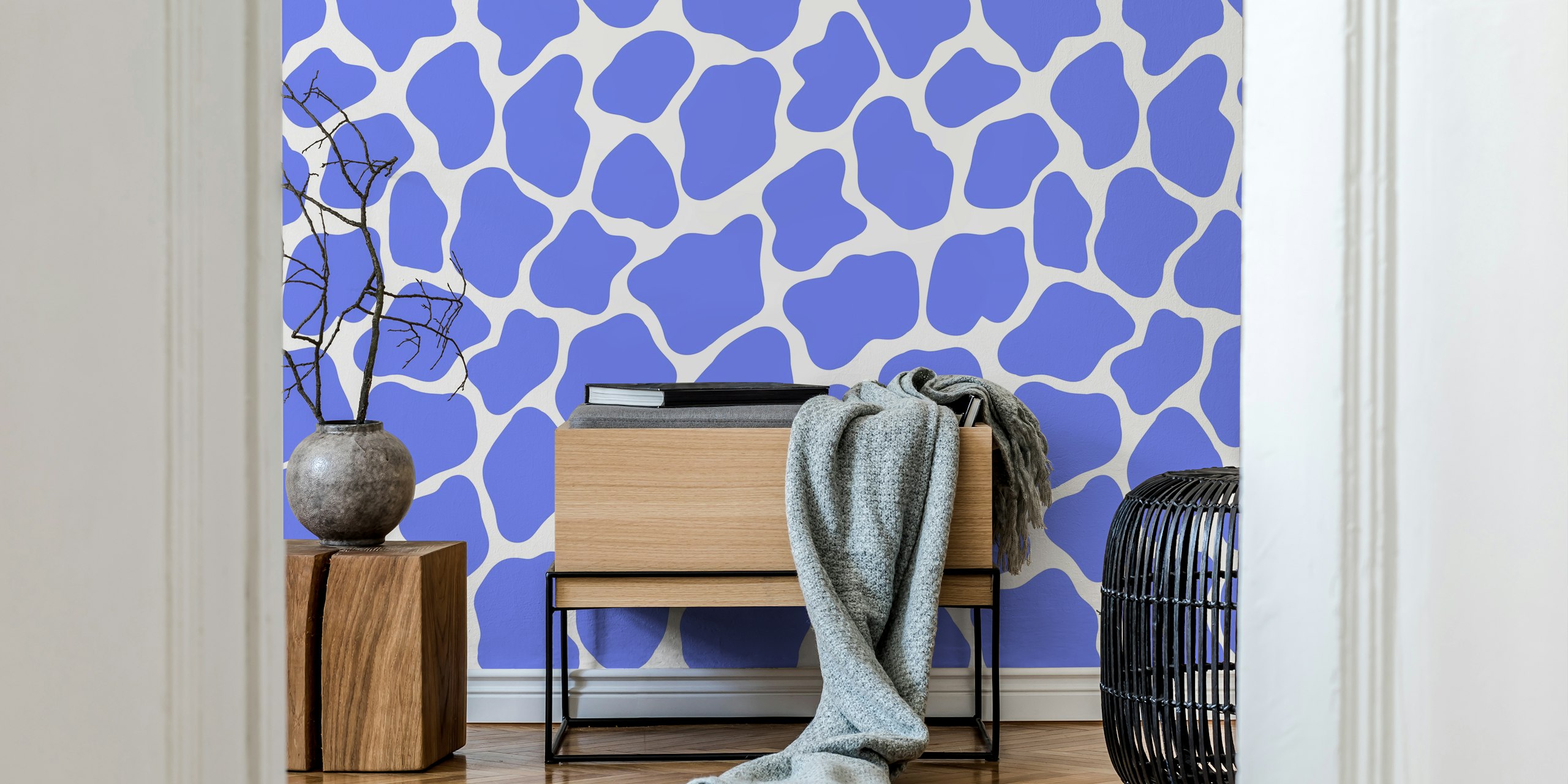 Blue giraffe pattern wallpaper in a room
