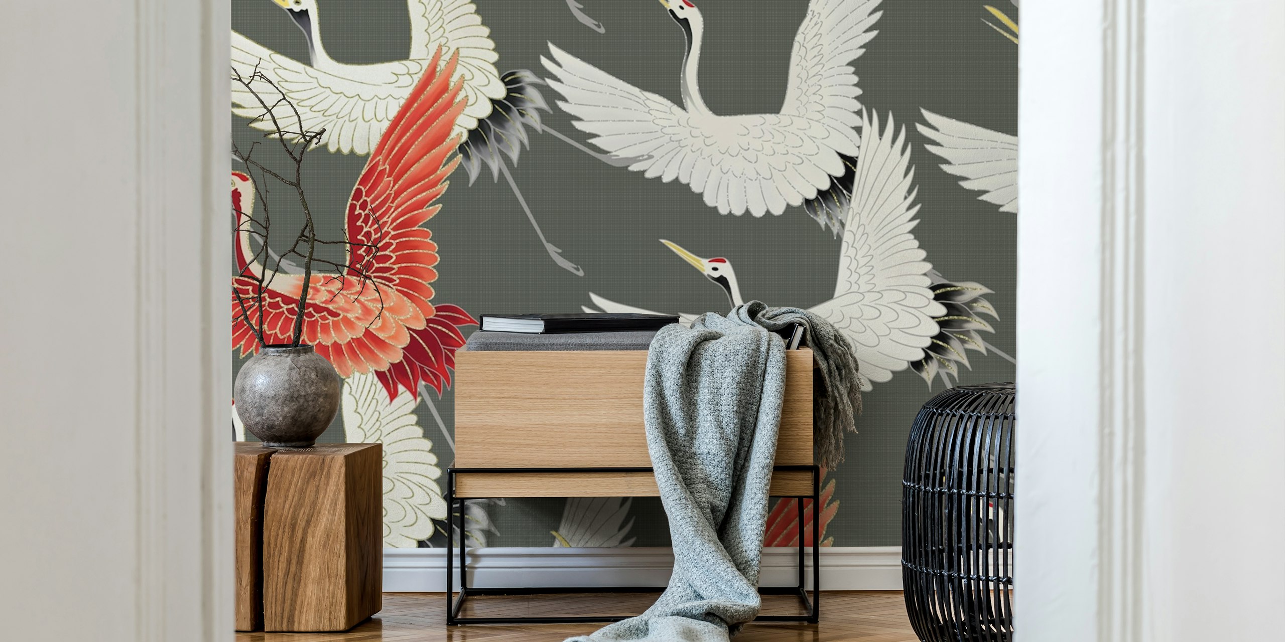 Artistic depiction of Japanese cranes in flight with a standout red crane against a grey background.