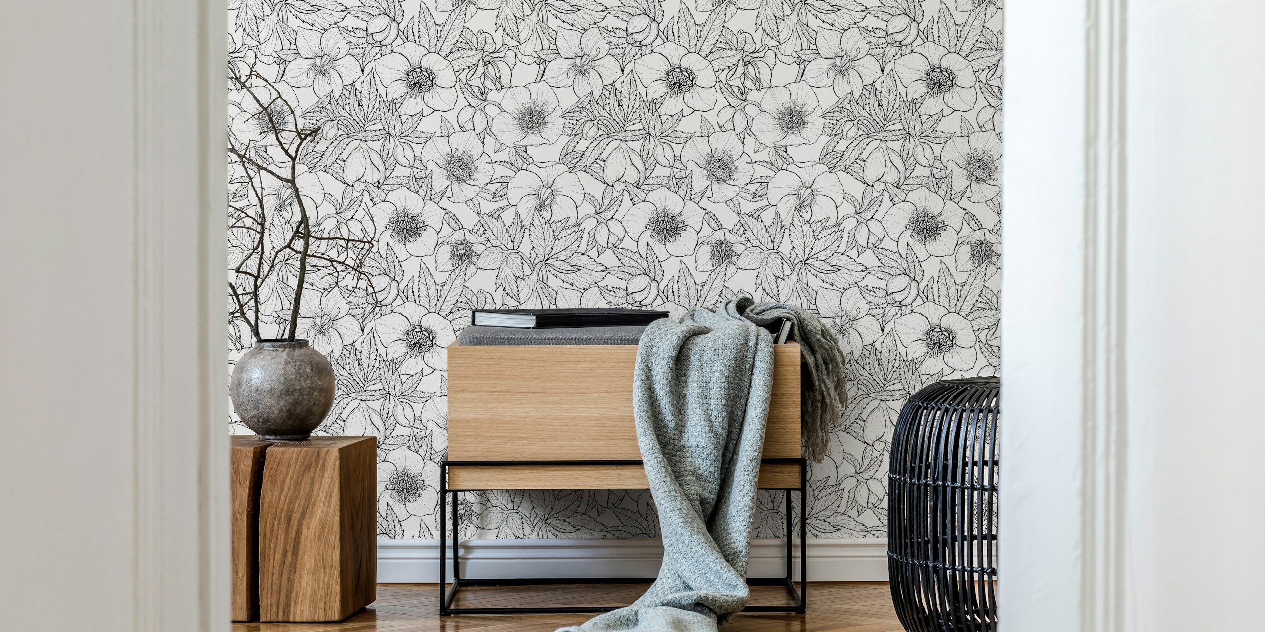 Black and white floral design wallpaper featuring hellebores and leaves