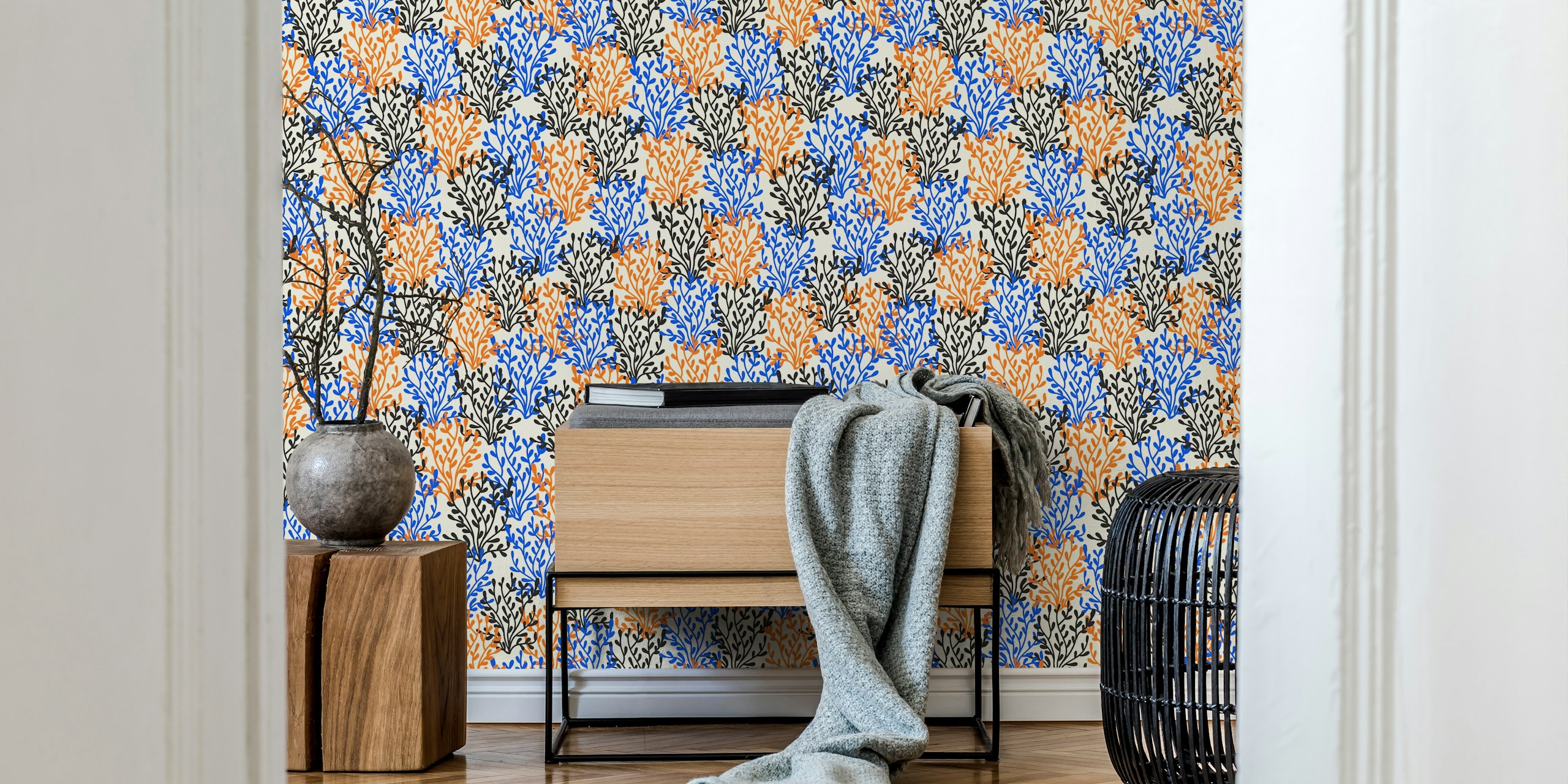 Colorful floral pattern in blue, orange, and black on cream background wallpaper