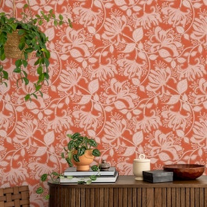 Honeysuckle stencil flowers wallpaper in pink salt on koi orange ground