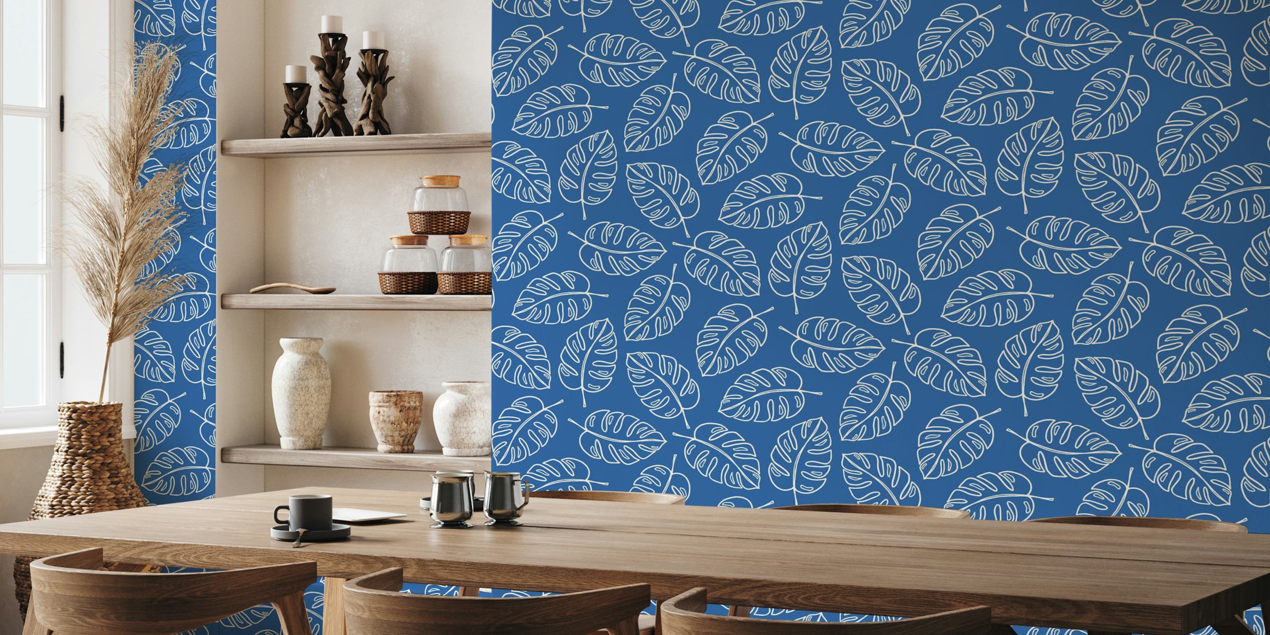 Blue wallpaper with white monstera leaves pattern
