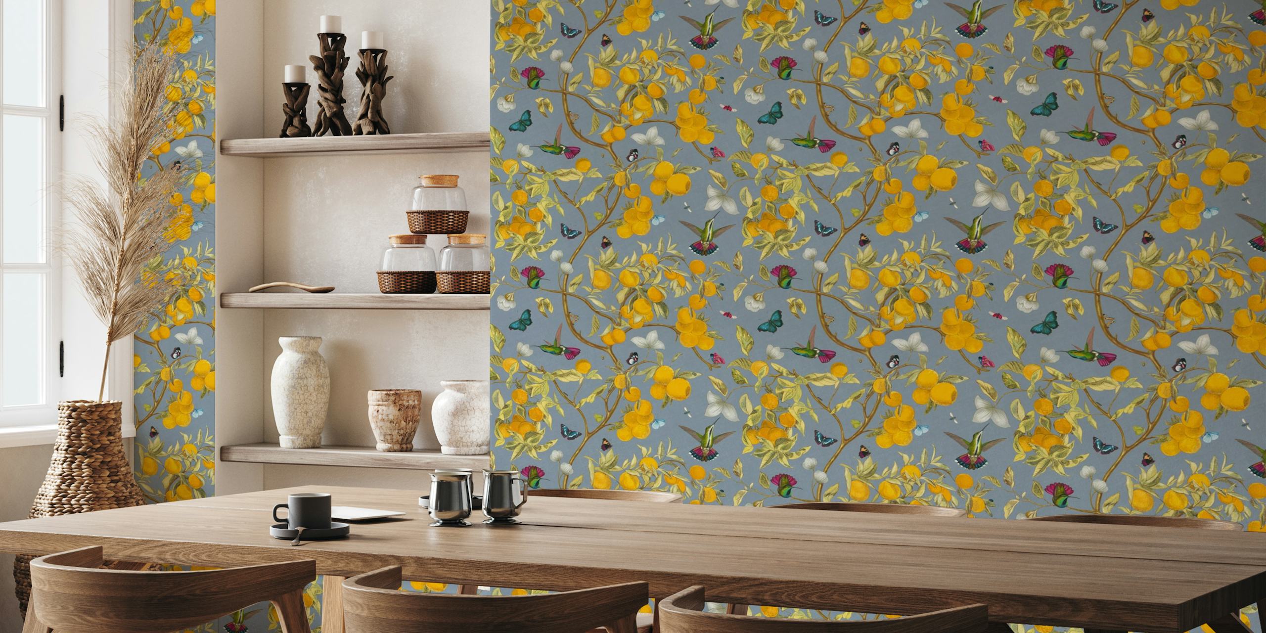 A wall mural with hummingbirds, yellow lemons, and butterflies on a slate background
