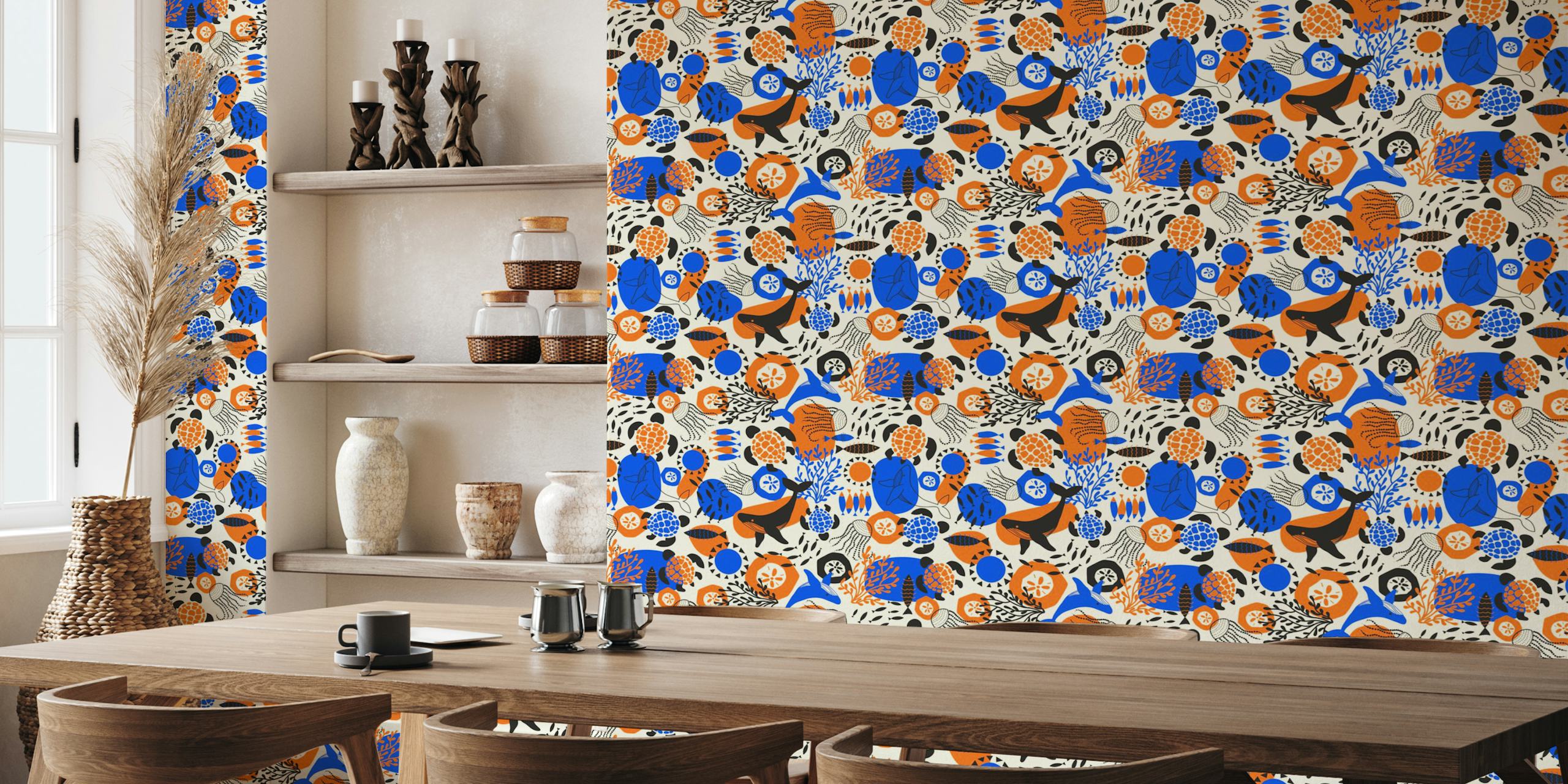 Ocean animals like whales and turtles in vibrant blue, orange, and black on cream wallpaper