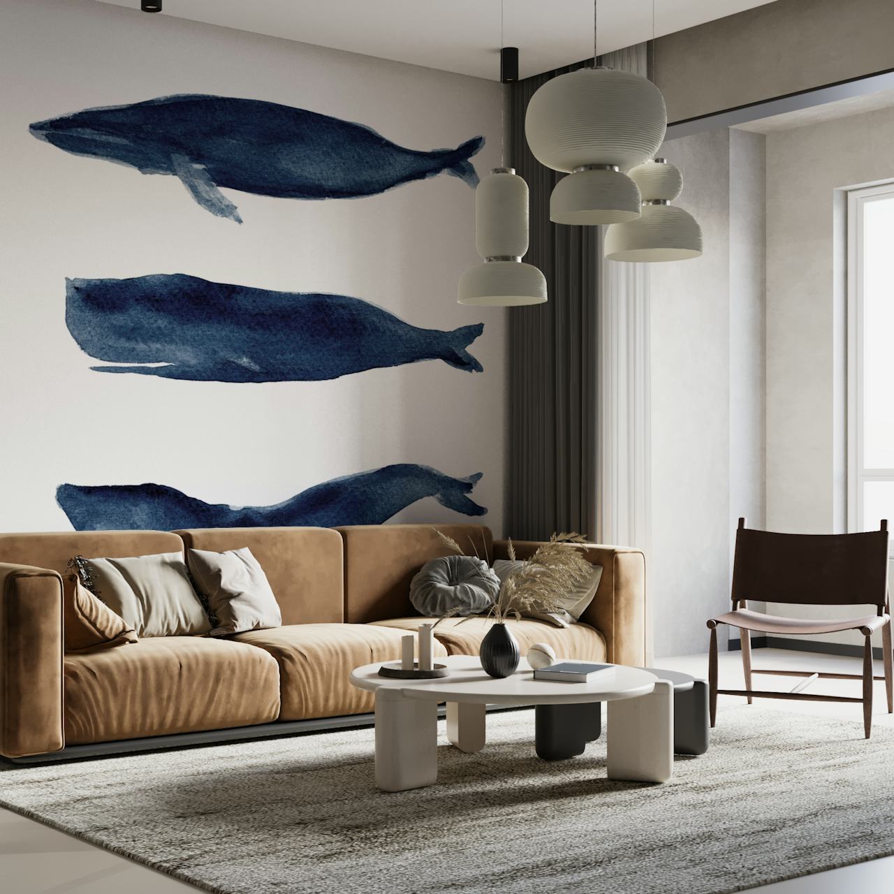 Illustrazione di tre balene blu su un murale su sfondo bianco