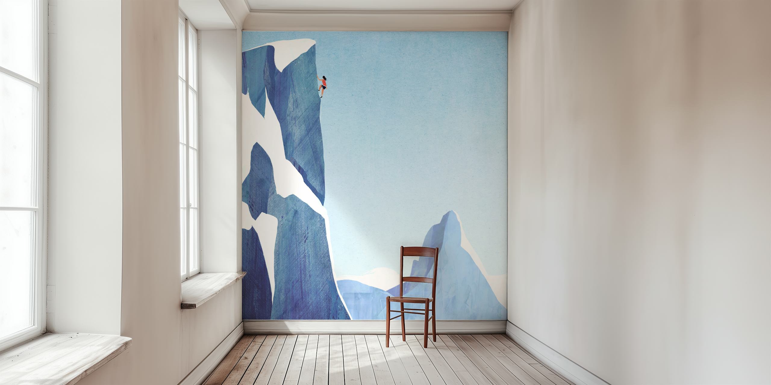 Mountain climber on a tall icy cliff with blue sky wallpaper