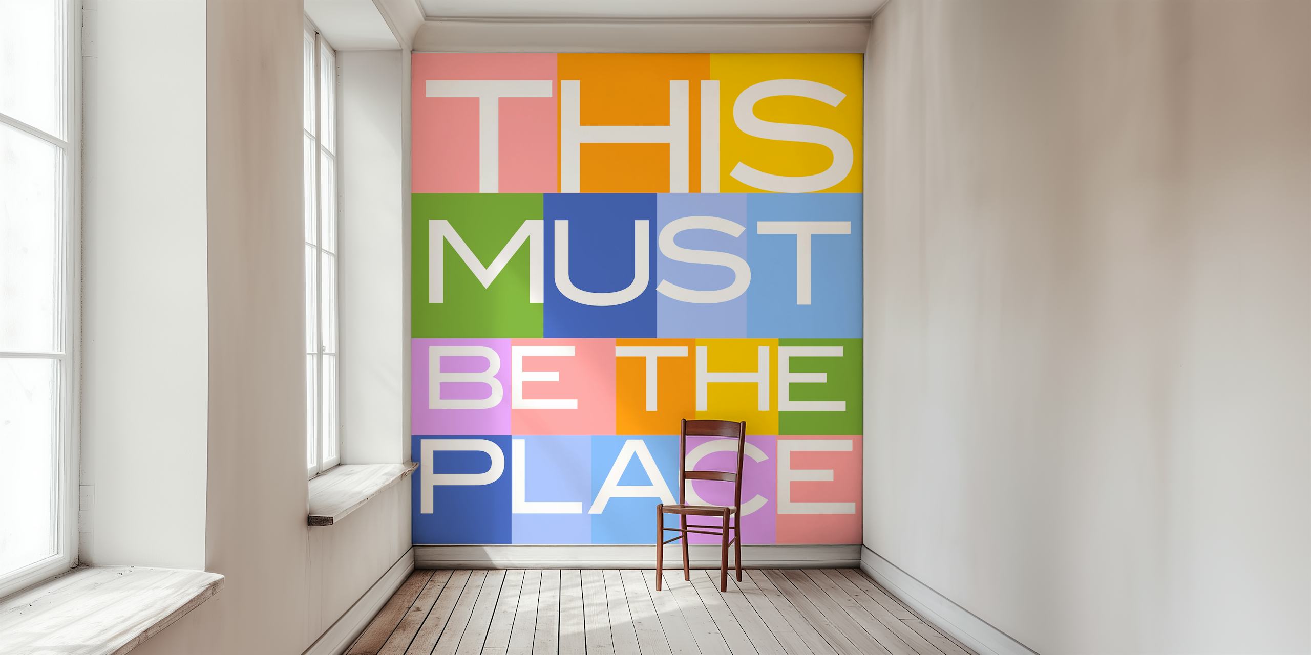 Färgglad tapet med This Must Be The Place text