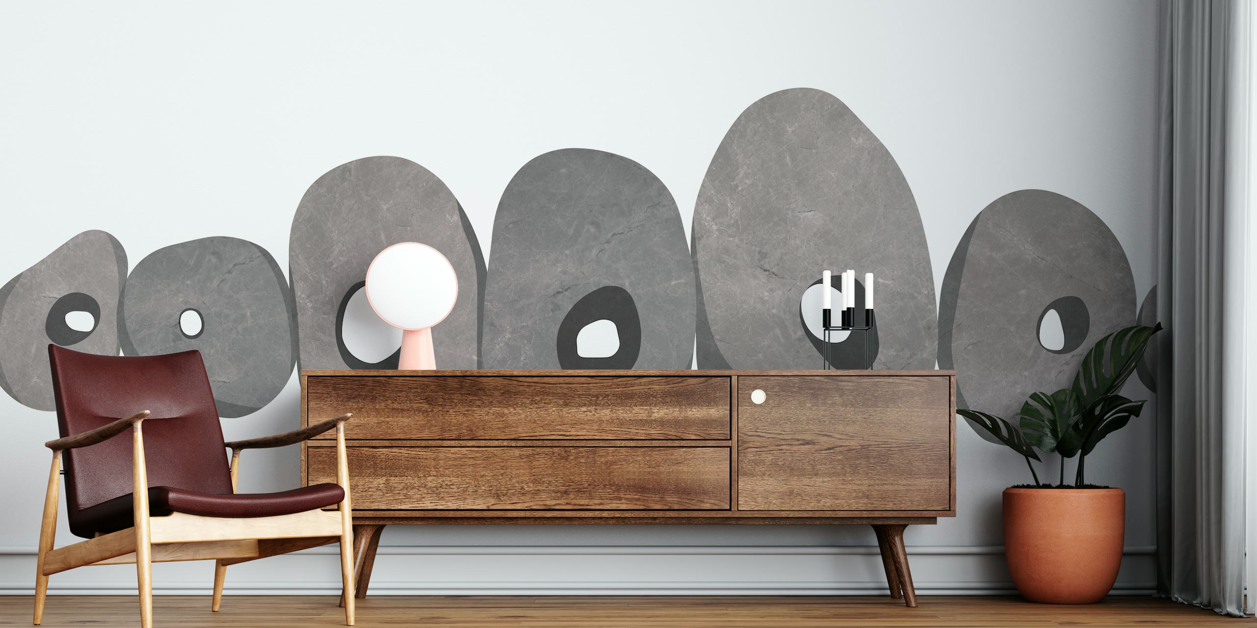 Strandstenvægmaleri med stablede sten i gråtoner