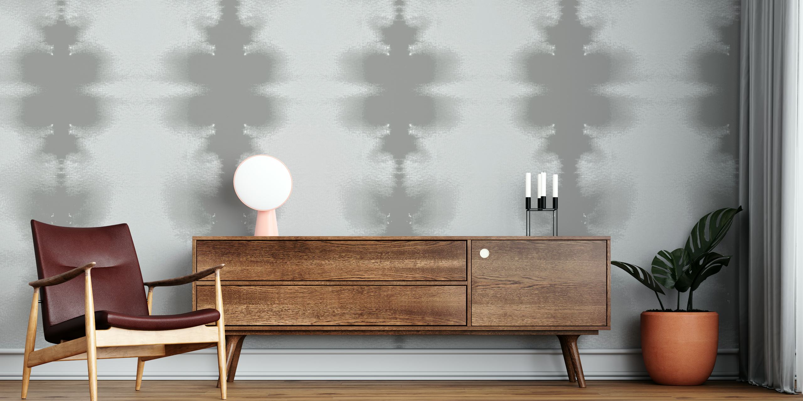 Mural de parede com padrão geométrico abstrato em tons de cinza, criando um ambiente zen