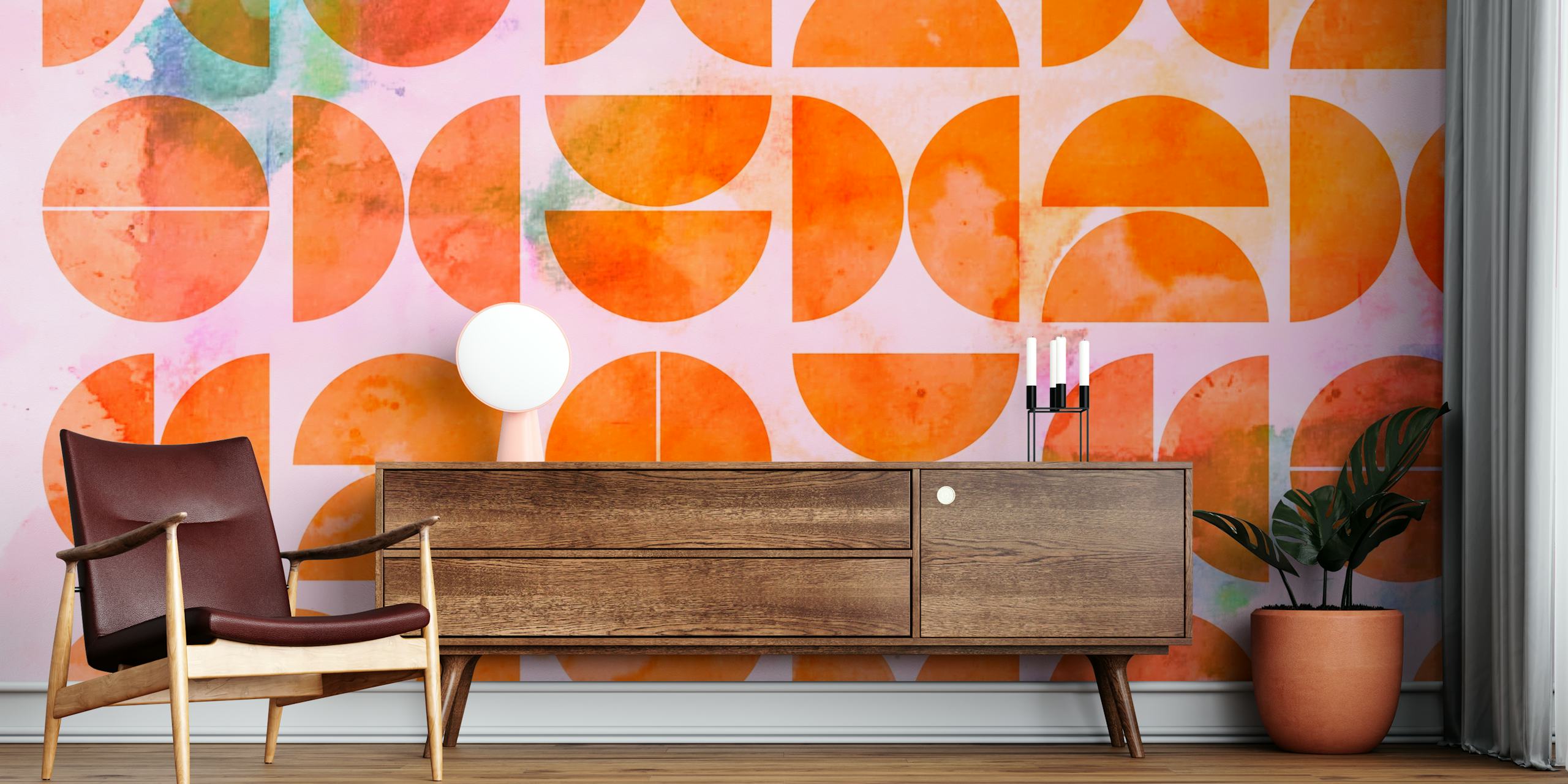 Geometric patterns in orange and teal on pink wallpaper